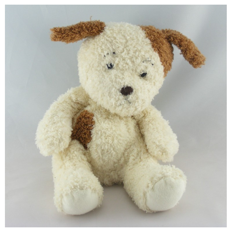 Doudou et compagnie chien couché blanc marron