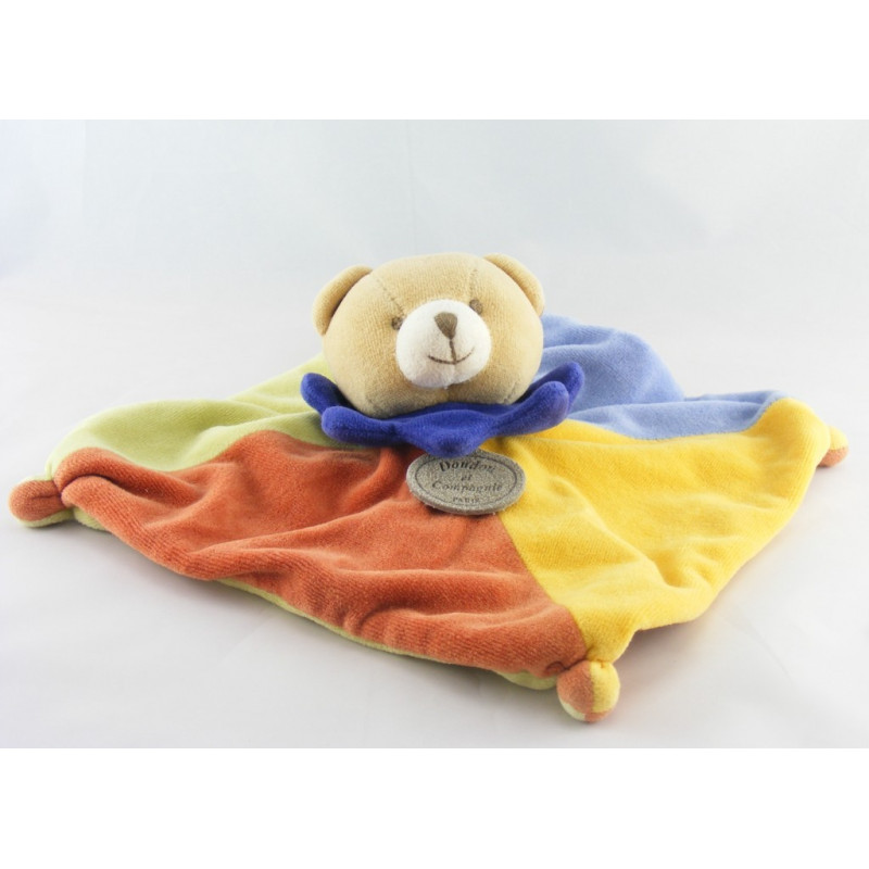 Doudou et compagnie Plat Ours arlequin bleu jaune orange vert