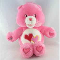 Peluche Bisounours chantante rose Groschéri avec 2 coeurs CARE BEARS