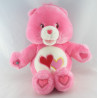 Peluche Bisounours chantante rose Groschéri avec 2 coeurs CARE BEARS