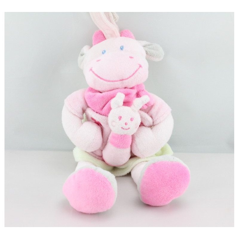 Doudou musical vache rose robe verte NICOTOY