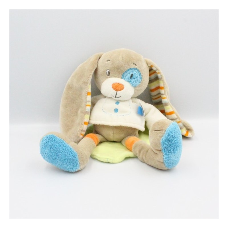 Doudou lapin beige pull blanc feuille verte TEX