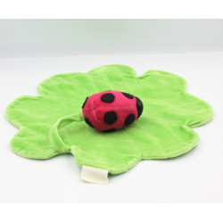 Doudou plat coccinelle rouge sur feuille verte TCF