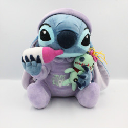 Peluche bébé Stitch avec monstre et biberon Lilo et Stitch DISNEYLAND
