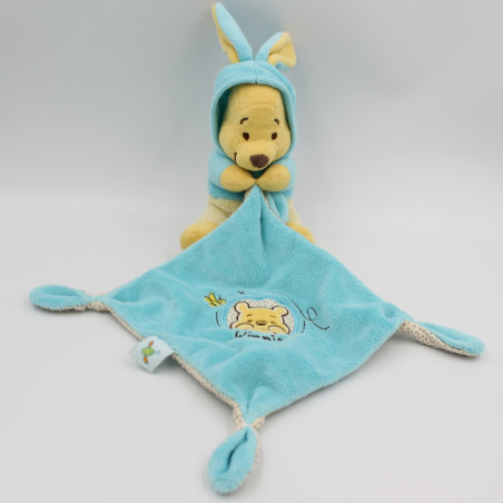 Doudou Winnie l'ourson déguisé en lapin bleu mouchoir DISNEY