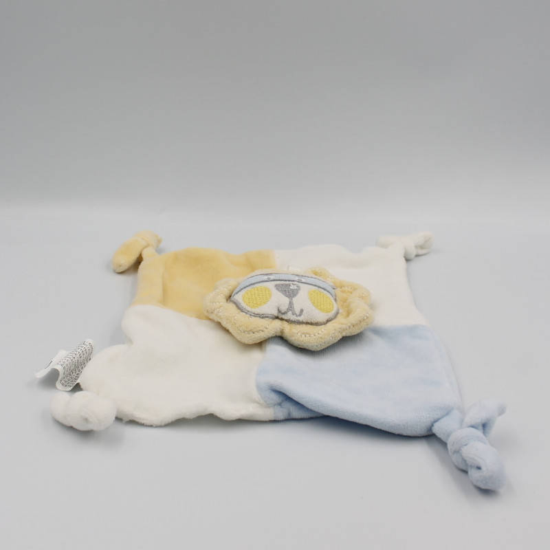 Doudou plat lion blanc bleu jaune SIPLEC