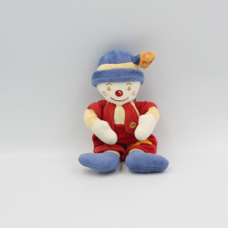 Doudou Clown salopette rouge chapeau bleu fleur Sucre d'Orge 22 cm
