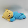 Doudou winnie l'ourson couché en pyjama bleu DISNEY