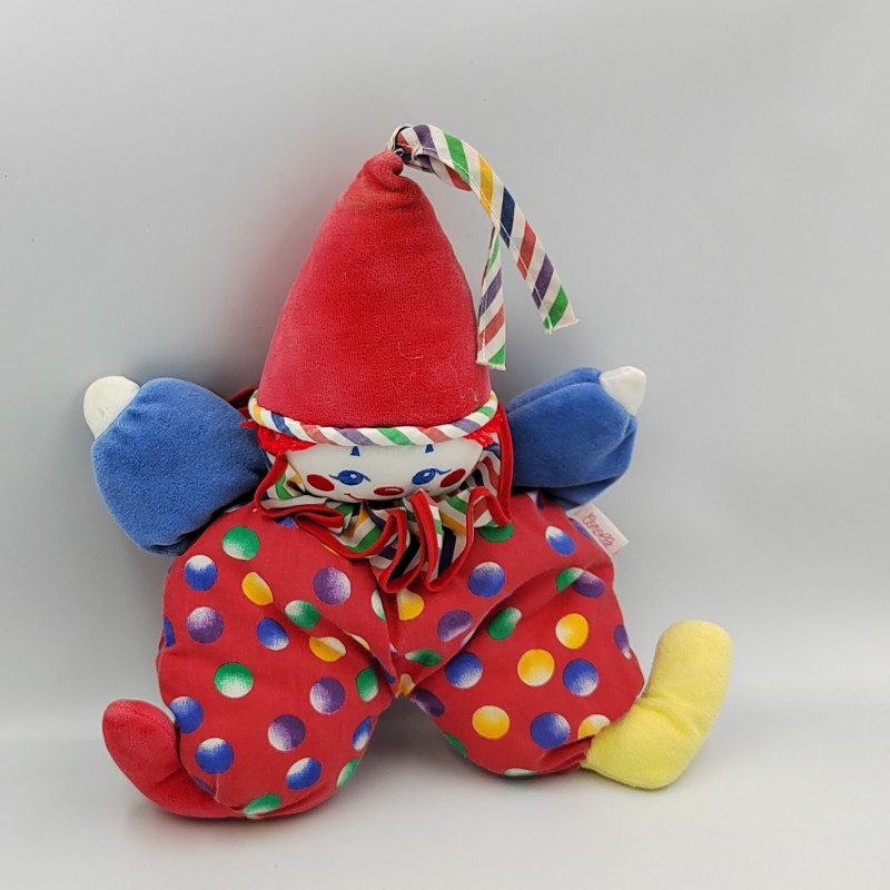 Doudou clown rouge bleu jaune pois grelot COROLLE