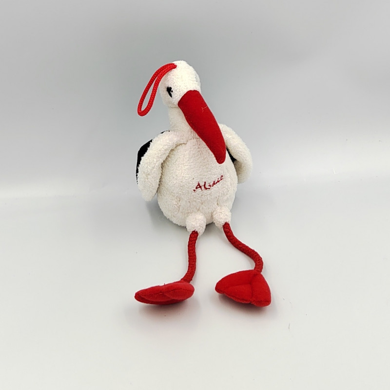 Peluche cigogne blanche rouge noir CP INTERNATIONAL
