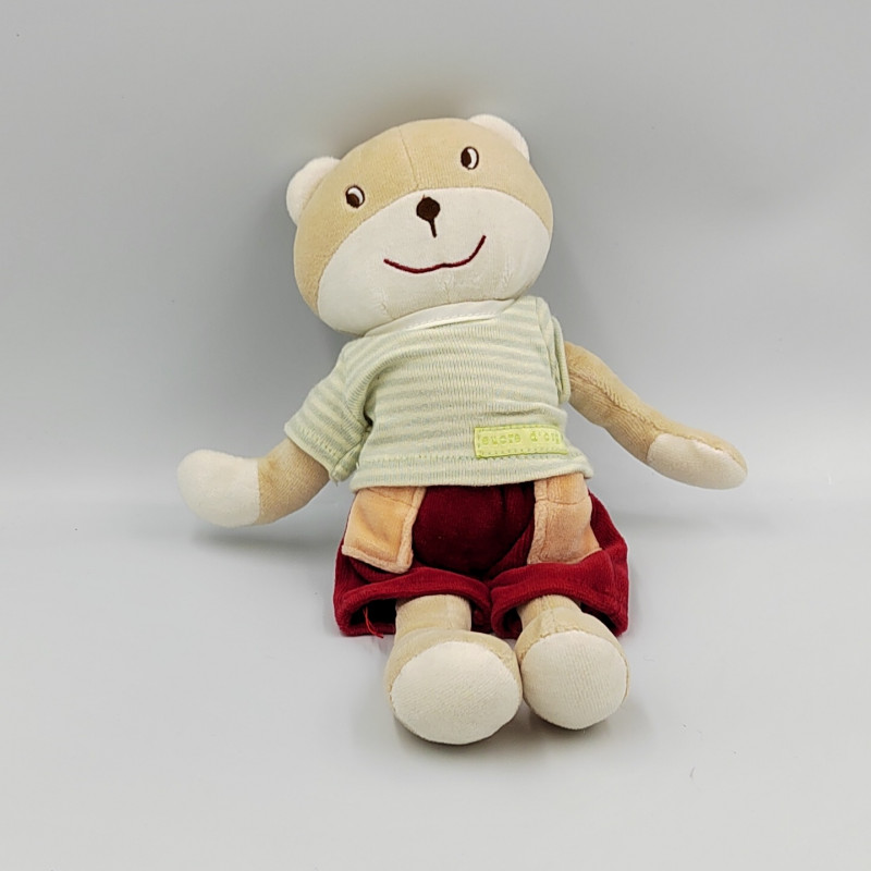 Doudou ours beige maillot rayé vert jaune short rouge SUCRE D'ORGE