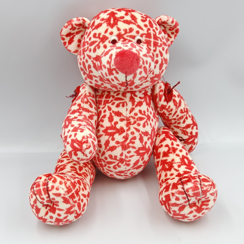 Doudou ours rouge blanc motifs boutons