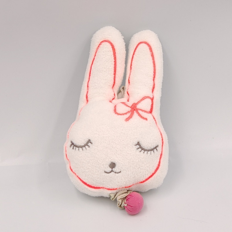 Petit doudou musical lapin blanc rose VERTBAUDET