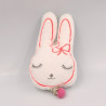 Petit doudou musical lapin blanc rose VERTBAUDET