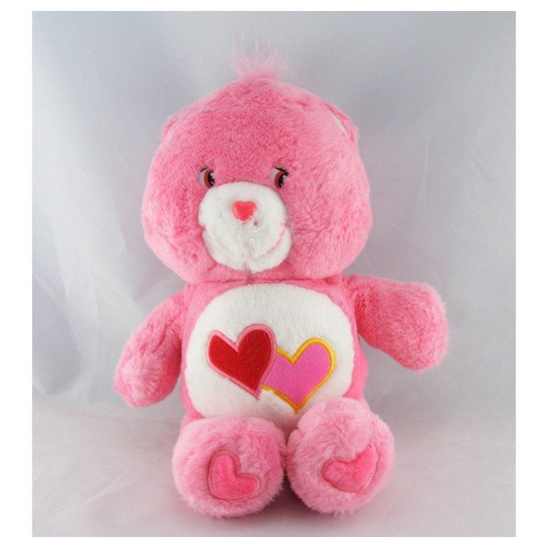 Peluche Bisounours rose Groschéri avec 2 coeurs CARE BEARS 29 cm
