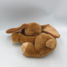 Peluche chien marron couché