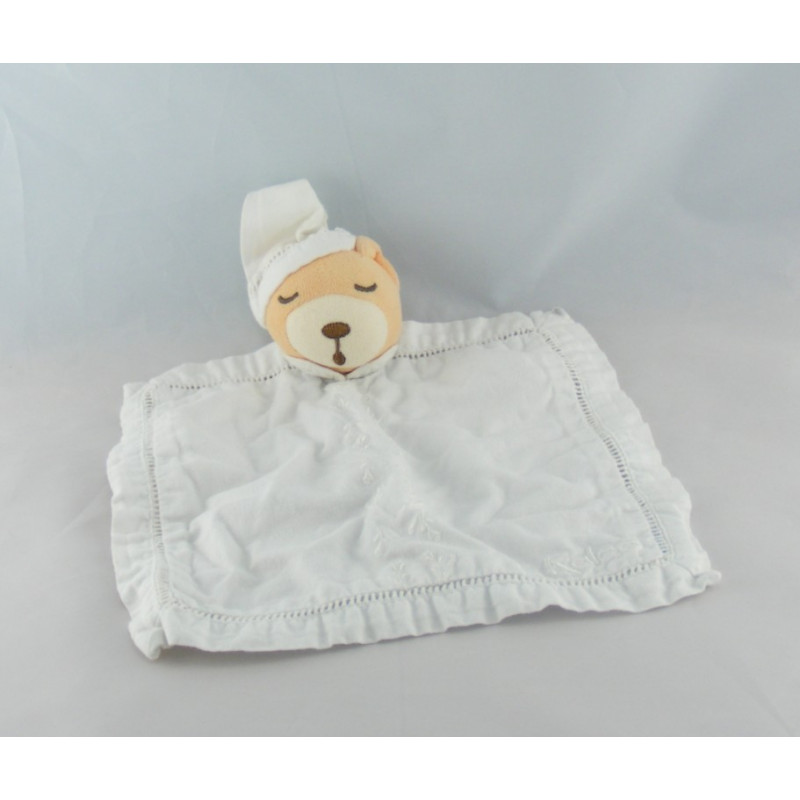 Doudou plat rond blanc ours dragée KALOO